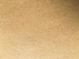 Old brown paper texture background or cardboard with copy space for design. photo