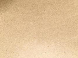 Old brown paper texture background or cardboard with copy space for design. photo