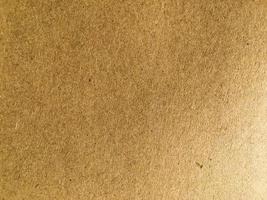 Old brown paper texture background or cardboard with copy space for design. photo