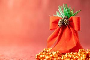 Red Christmas bell on the background. Christmas ornaments concept. photo