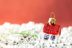 Christmas house on a red background photo