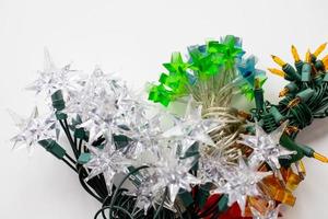 Different types of lights for a Christmas tree on a white background photo