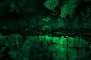 Scary dark green grunge wall concrete cement texture background photo