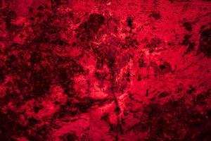 Scary dark red grunge wall concrete cement texture background photo