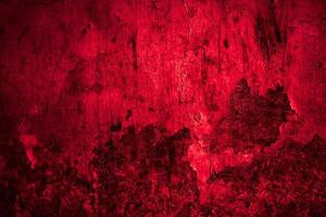 Scary dark red grunge wall concrete cement texture background photo