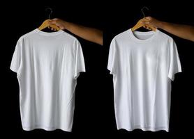 hand holding hanger plain t-shirts for mockup design. blank t-shirts from the front and back view isolated background photo