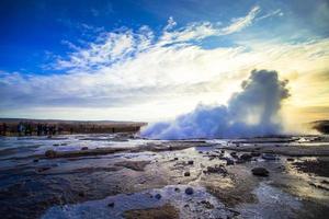 Strokkur, one of the most famous geysers located in a geothermal area beside the Hvita River in the southwest part of Iceland, erupting once every 6-10 minutes photo