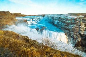 Gullfoss, or Golden Fall, a waterfall where is part of the Golden Circle located in the canyon of Olfusa river in southwest Iceland photo