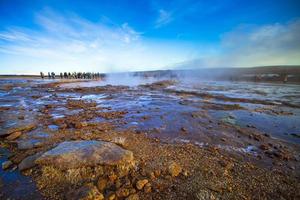 Strokkur, one of the most famous geysers located in a geothermal area beside the Hvita River in the southwest part of Iceland, erupting once every 6-10 minutes photo