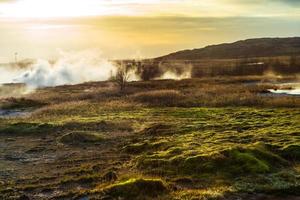 Strokkur, one of the most famous geysers located in a geothermal area beside the Hvita River in the southwest part of Iceland, erupting once every 6-10 minutes photo