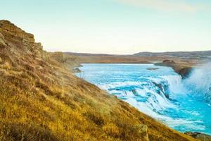 Gullfoss, or Golden Fall, a waterfall where is part of the Golden Circle located in the canyon of Olfusa river in southwest Iceland photo