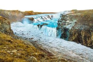 Gullfoss, or Golden Fall, a waterfall where is part of the Golden Circle located in the canyon of Olfusa river in southwest Iceland photo