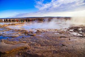 Strokkur, one of the most famous geysers located in a geothermal area beside the Hvita River in the southwest part of Iceland, erupting once every 6-10 minutes photo