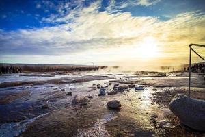 Strokkur, one of the most famous geysers located in a geothermal area beside the Hvita River in the southwest part of Iceland, erupting once every 6-10 minutes photo