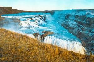 Gullfoss, or Golden Fall, a waterfall where is part of the Golden Circle located in the canyon of Olfusa river in southwest Iceland photo