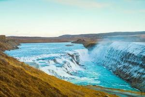 Gullfoss, or Golden Fall, a waterfall where is part of the Golden Circle located in the canyon of Olfusa river in southwest Iceland photo