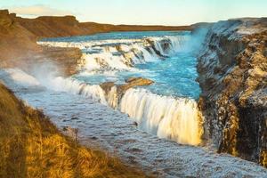 Gullfoss, or Golden Fall, a waterfall where is part of the Golden Circle located in the canyon of Olfusa river in southwest Iceland photo