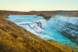 Gullfoss, or Golden Fall, a waterfall where is part of the Golden Circle located in the canyon of Olfusa river in southwest Iceland photo