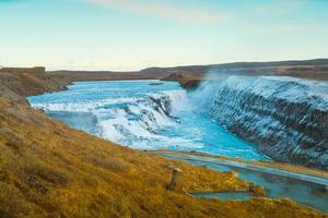 Gullfoss, or Golden Fall, a waterfall where is part of the Golden Circle located in the canyon of Olfusa river in southwest Iceland photo