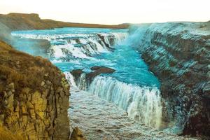 Gullfoss, or Golden Fall, a waterfall where is part of the Golden Circle located in the canyon of Olfusa river in southwest Iceland photo