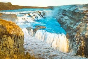 Gullfoss, or Golden Fall, a waterfall where is part of the Golden Circle located in the canyon of Olfusa river in southwest Iceland photo