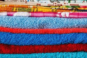 stack of colored towels full frame close-up background photo