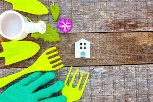 Gardening Tools on wooden background photo