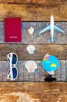 Concept of traveling on wooden background photo