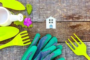 Gardening Tools on wooden background photo