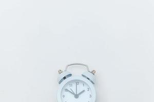 Simply flat lay design Ringing twin bell vintage classic alarm clock Isolated on white background. Rest hours time of life good morning night wake up awake concept. Flat lay top view copy space. photo