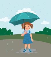 cute little girl holding umbrella in the rain on rainy day at the park vector