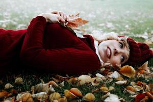 a young woman with autumn fashion on a meadow photo