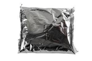small blank single-use crumpled aluminum foiled plastic bag isolated on white background photo