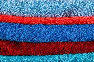 stack of colored towels full frame close-up background photo