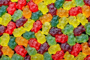 full-frame background and texture of colorful jelly bears laid closely photo