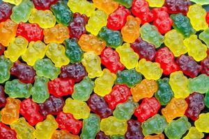 full-frame background and texture of colorful jelly bears laid on flat surface photo