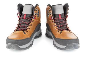 pair of brown insulated winter warm three quarter sneaker or boot isolated on white background photo
