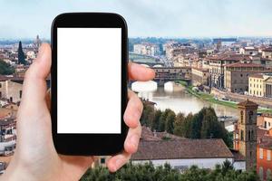 tourist photographs Florence city with arno river photo