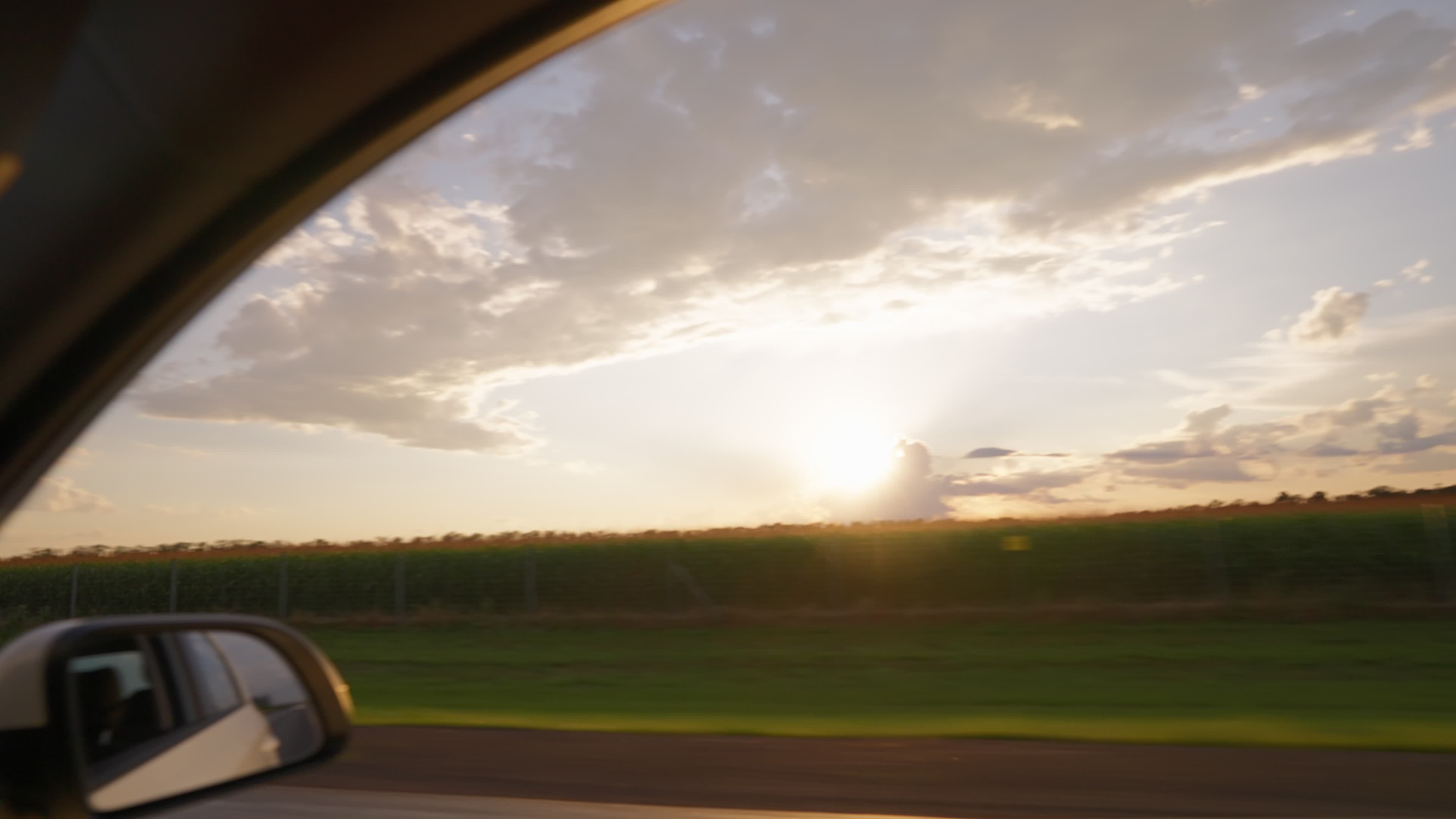 View from the side window of a car driving fast along the highway