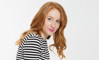 Woman beauty power. Close up of red haired girl face, leather jacket isolated on white background. Skin care, blue eyes and beautiful face. Copy space and selective focus. Redhead, make up. Banner photo