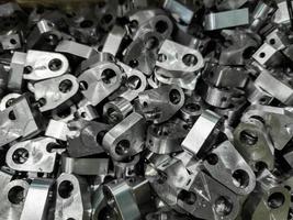 pile of shiny steel parts, full frame industrial background photo