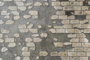 full-frame background and texture of damaged brick pavement photo