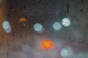 an abstract background of night wet window glass photo