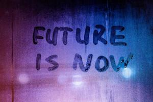 words future is now handwritten on night foggy window glass surface photo