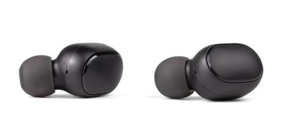 two black wireless earbuds isolated on white background - close-up with selective focus photo