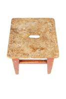 Old wooden stool with peeling brown paint. Loft style chair isolated on a white background. photo