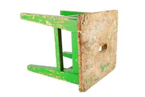 Old wooden stool with peeling lime green paint. Loft style chair isolated on a white background. photo