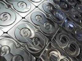 shiny metal machined digit 8 plates tiled tightly - full frame background photo