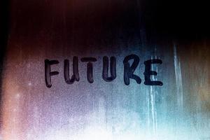 word future handwritten on night foggy window glass surface photo