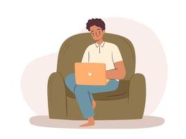 Man working on laptop in armchair vector